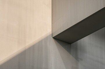Fototapeta premium Morning light sculpts concrete geometry into a quiet balance of form and tone