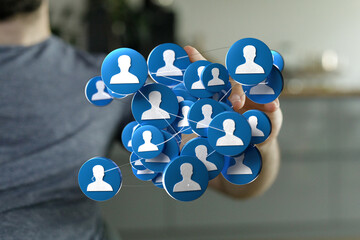 Illustrating interconnected social network avatars held by a man's hand, visualizing modern communication methods and digital connections.