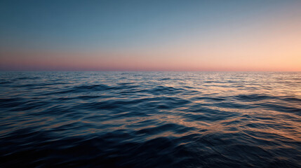 Calm sea at golden hour with serene horizon and gentle waves