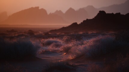 Fototapeta premium Waves crashing gently on shore at sunset near rocky mountains in serene landscape