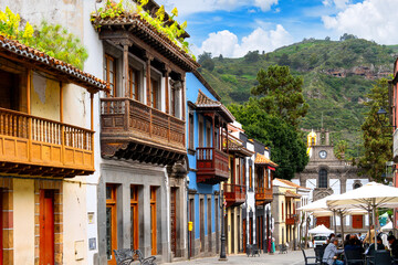 Teror, Spain, 11. May 2025- Old town of Teror is famous for its ornate wooden balconies, narrow alleys, and charming atmosphere. In background the Basilica Nuestra Señora del Pino