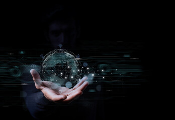 Concept of global technology, data network, and digital communication visualized through a glowing holographic globe floating above a person's open hand.