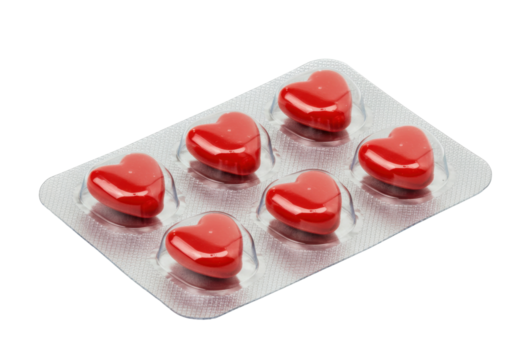 Red heart-shaped pills in blister pack isolated, love and health concept for medical or pharmaceutical use