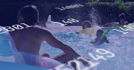 Relaxing white male wearing swim trunks reclining on inflatable ring in backyard pool, copy space