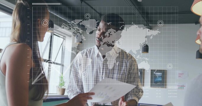 Discussing three colleagues examining printed charts in modern office, with world map overlay