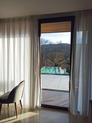 Remote villa with swimming pool lay hidden in the forest of north Portugal. Remote nature travel. Villa on a hillside overlooking lush green valleys and mountains. Holiday accommodation.Peaceful rural