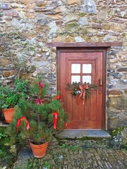 Old house in Talasnal, Schist villages in Portugal, maintain the old traditions. Historical buildings. Aldeias de Xisto. Historic house decorated for the festive season in winter 2026. Christmas tree