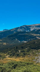 Obraz premium Mountain view of the Rila Mountains in Bulgaria. Seven Rila Lake hike. Eco trails. Connection with nature. 