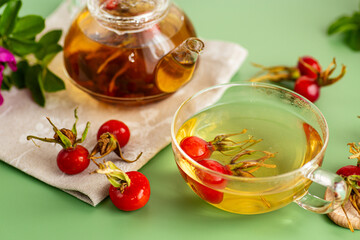 hot rosehip tea with flowers and berries