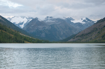 Evening view of Middle Multinskoye lake with snow-covered Altai mountains in the background, Russian Federation