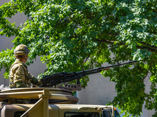 Soldier with machine gun in urban operation