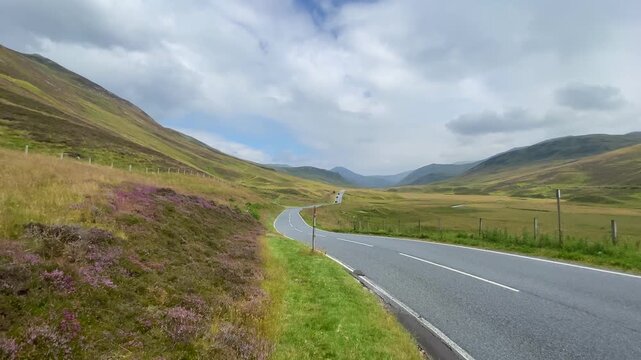 On the road along the Loch Lurgainn, Scottland. It is a large deep loch located north along the west coast from Ullapool, Scotland