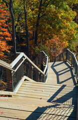 Looking down a cliff stairway amid autumn foliage in Rocky River Reservation, a Greater Cleveland Ohio metro park