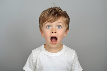 Surprised Boy with Wide Eyes and Open Mouth