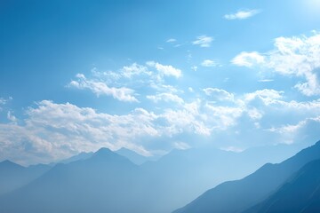 Mountains under a bright blue sky with fluffy clouds in the daytime