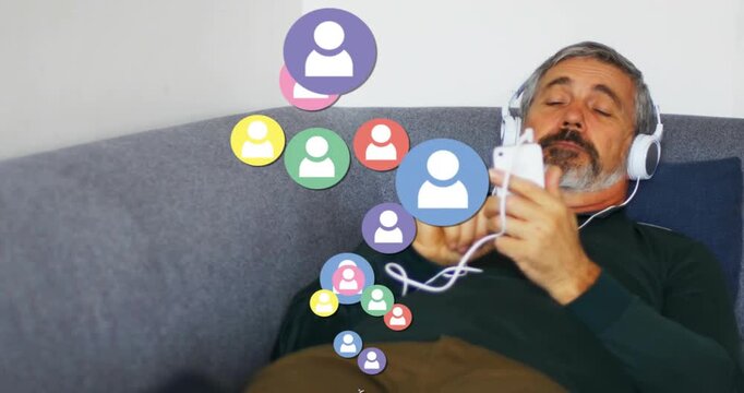 Male on sofa tapping smartphone screen showing social media engagement with expanding user icons