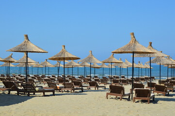beach chairs and umbrellas on the beach