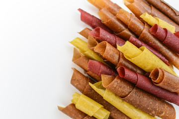 Fruit paste. Berry candy on a white background. apple, pear, orange, plum marshmallow rolls
