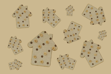 decorative wooden houses on a gentle beige background. wooden Toys. housing and construction concept