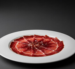 Hyperrealistic Gourmet Presentation of Iberian Bellota Ham on White Plate