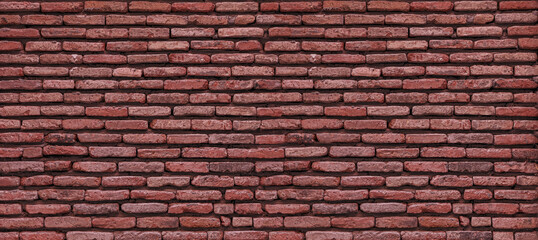 Old red brick wall forming a textured background