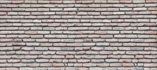 Weathered brick wall showing vintage masonry texture background