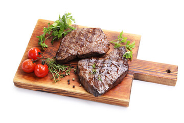 Delicious grilled beef steaks with herbs, peppercorns and tomatoes isolated on white