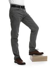 Naklejka premium Man in stylish jeans on white background, closeup