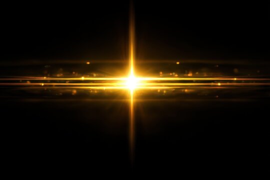 abstract lens flare yellow light over black background
 - Powered by Adobe