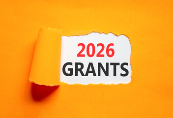2026 Grants symbol. Concept words 2026 Grants on beautiful white paper. Beautiful orange paper background. Business and 2026 grants concept. Copy space.