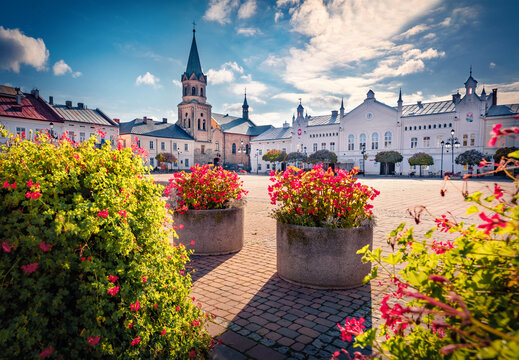 Exciting autumn view of market square with spire of Klasztor Franciszkanow Monastery. Adorable  morning cityscape of Sanok town,  Subcarpathian Voivodeship of southeastern Poland, Europe.