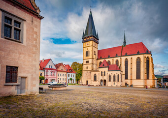 Majestic autumn view of empty street of Bardejov town with Basilica of St Giles church on background. Exciting autumn cityscape of Bardejov town, Slovakia, Europe. Traveling concept background.