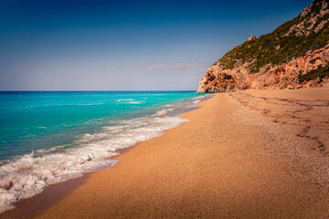 Picturesque summer scene of empty Kathisma Beach. Splendid morning seascape of Ionian sea. Amazing outdoor scene of Lefkada Island, Greece, Europe. Vacation concept background.