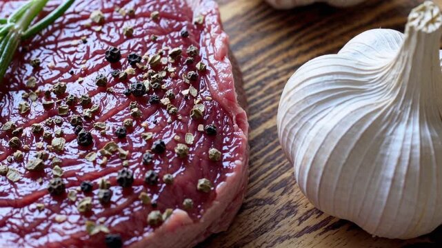 Preparing a succulent steak with garlic and herbs for a delicious dinner experience