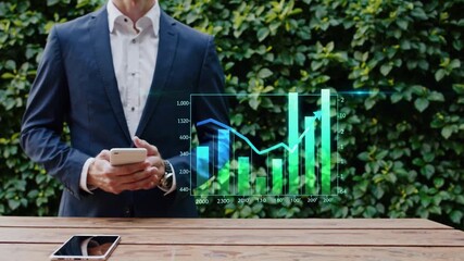 Professional analyzing financial trends outdoors while holding smartphone in front of digital graph display - Powered by Adobe