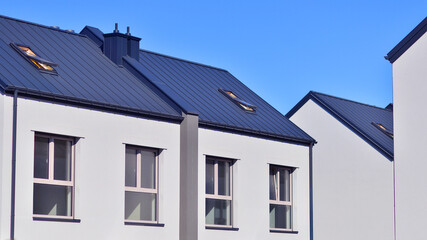 Newly built terraced houses in a residential area. Modern terraced houses on the outskirts of the city.
