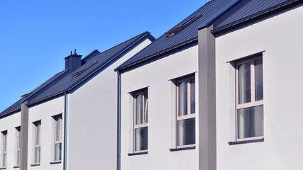 Newly built terraced houses in a residential area. Modern terraced houses on the outskirts of the city.