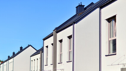 Newly built terraced houses in a residential area. Modern terraced houses on the outskirts of the city.