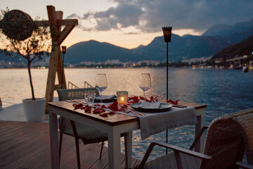 Romantic Waterfront Dining Experience with Scenic Views and Candlelit Ambiance at Dusk