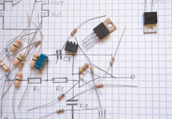 Circuit components on a drawing of an electronic diagram. basic electronics training, education or engineering concept.