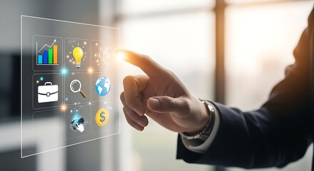 Man interacting with a transparent interface displaying business and financial icons near window light