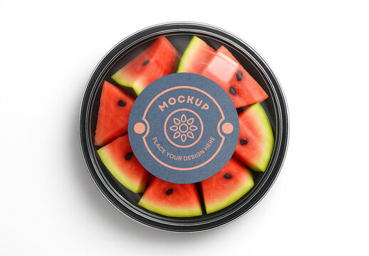Realistic Food Packaging Mockup with Watermelon Slices &ndash; Top View Transparent Plastic Container with Circular Blank Label for Fresh Fruit Branding and Healthy Product Design
