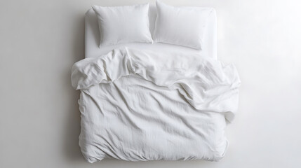 Aerial view of an unmade bed with white linens and two pillows. The duvet is casually rumpled, suggesting a comfortable and inviting atmosphere.