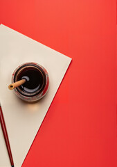 Gold bars arranged in pyramid shape on red background for Lunar New Year  