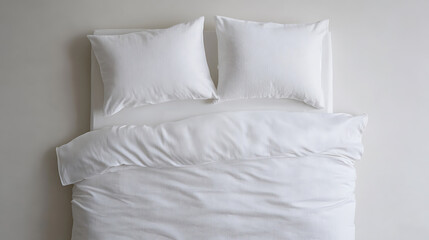 A neatly made bed with crisp, white linen conveys a sense of calm and comfort. Pillows are plumped, and the duvet is smooth, creating an inviting resting place.
