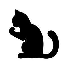 Silhouette of a black cat grooming itself with its paws, clean feline
