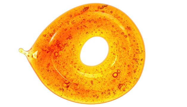 A swirling, translucent, amber-colored liquid forms a spiral shape with a dark, central hole