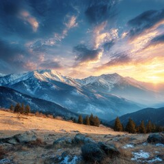 Mountain landscape of snow-capped mountains in the mist.
