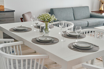 Elegant Dining Table Set for Modern Living Room with Comfortable Grey Sofa and Decorative Floral Centerpiece