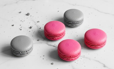 Pink and gray macarons on white marble background, concept of dessert elegance, French pastry and minimalist food design